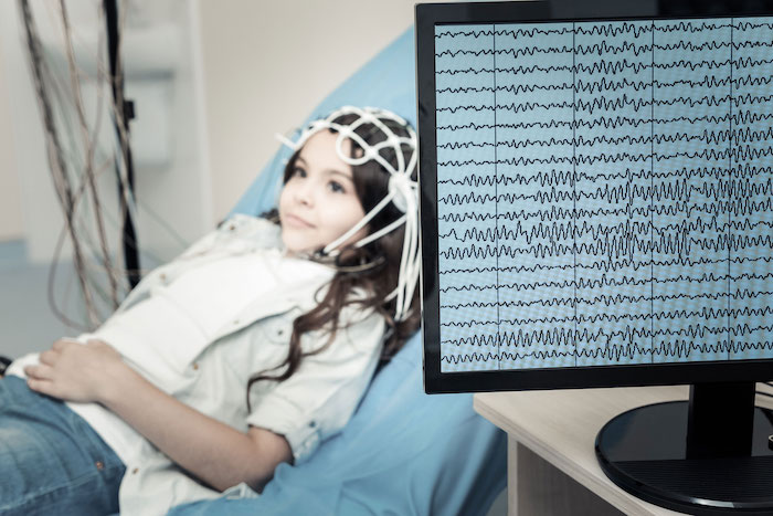 Girl receiving EEG test